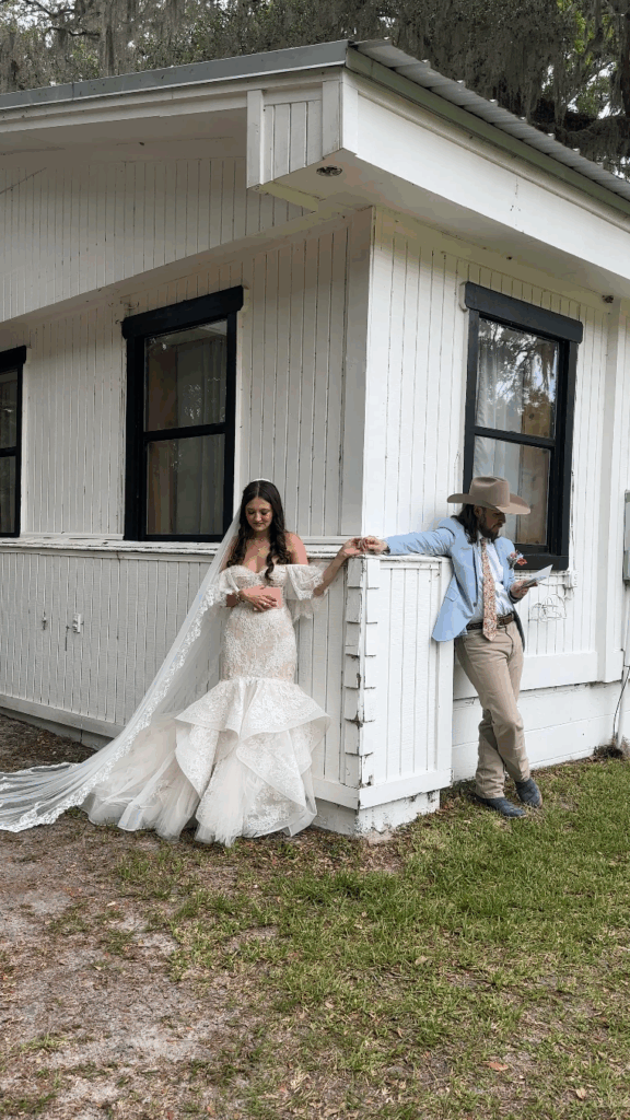 image from wedding content creator Image taken by a wedding content creator of the bride and groom's "first touch" where they read each other their vows.